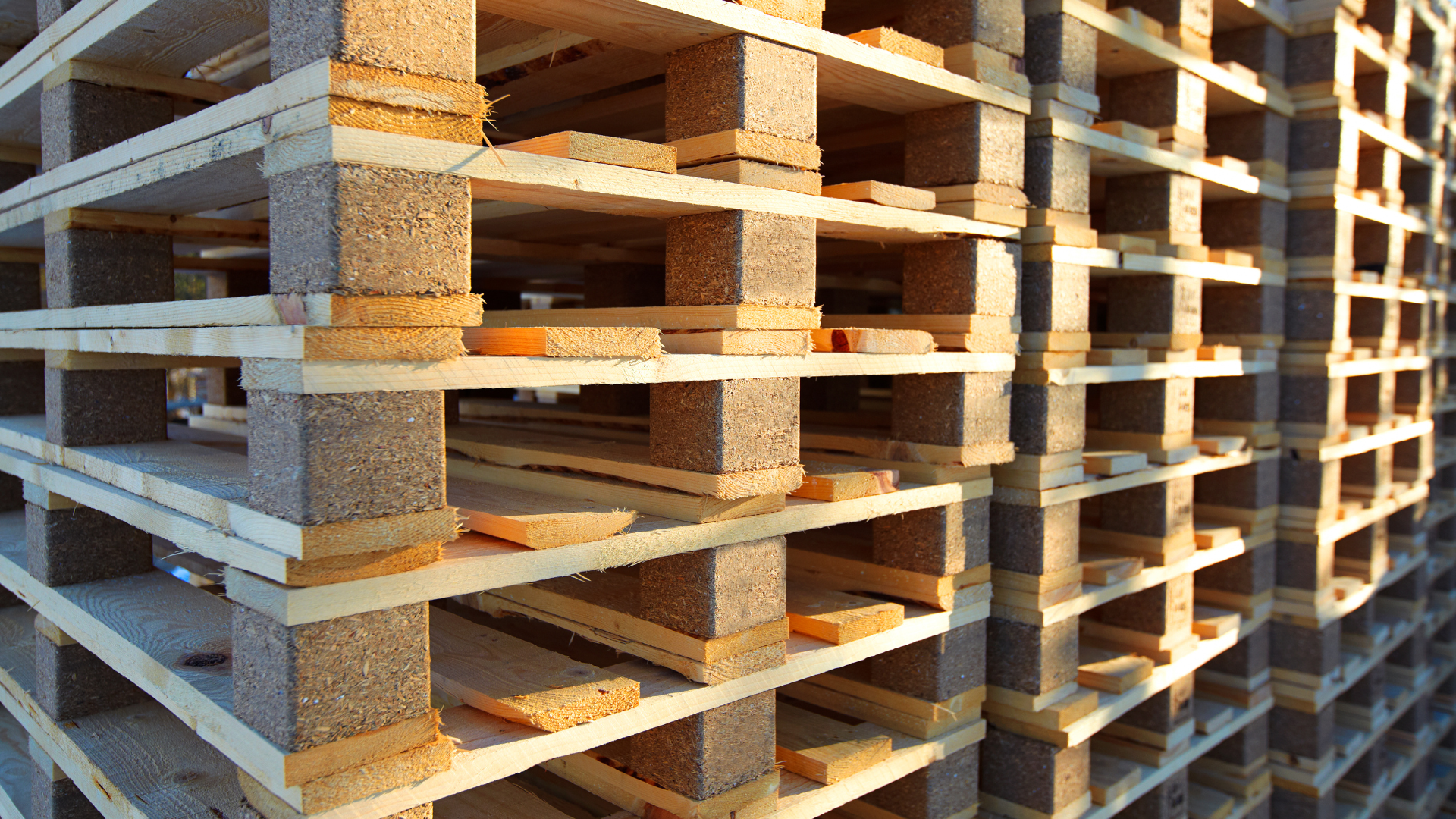 A stack of wooden pallets stacked on top of each other.