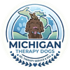 Ugly Dog Michigan logo with brown dog in a hexagon and text “Becoming a SEL Therapy/Service Dog of Michigan”