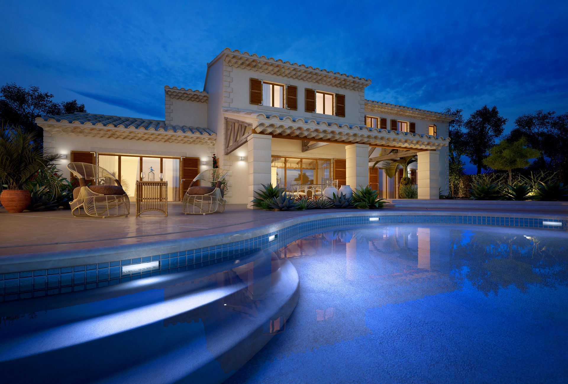 Luxury villa lit at dusk beside a glowing blue swimming pool