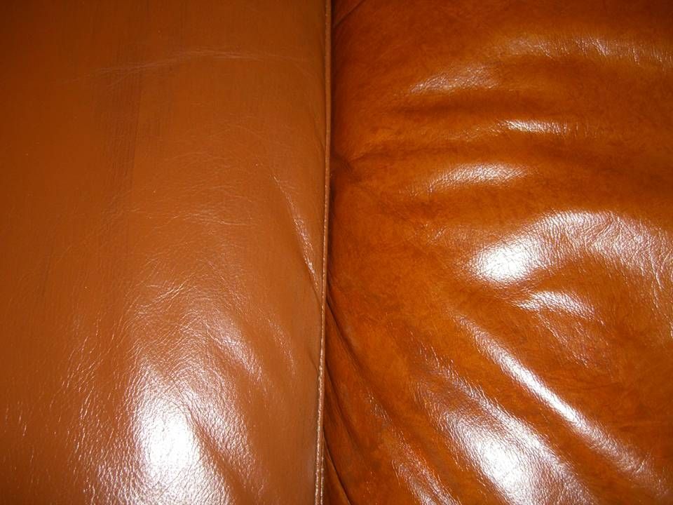 Close-up of brown leather sofa, contrasting sections with different textures and sheen.