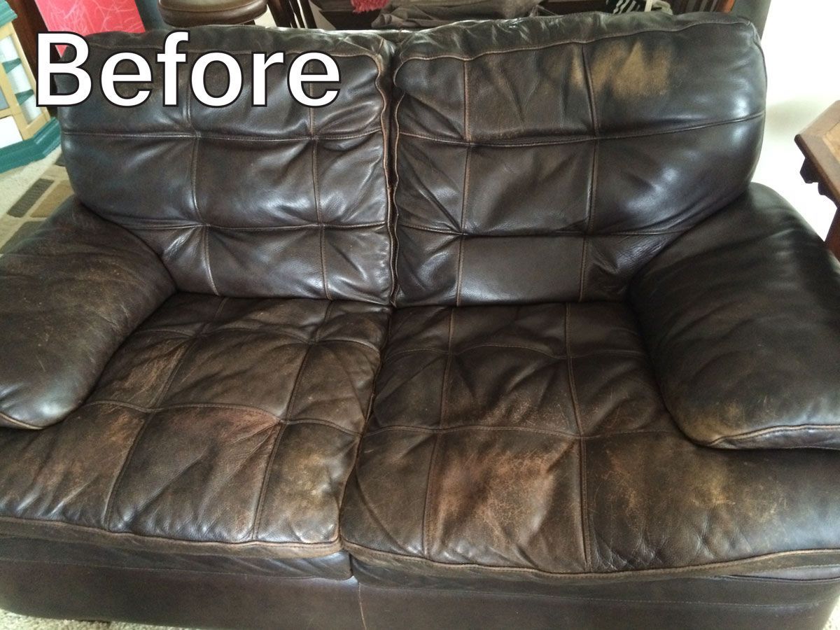 Brown leather sofa, worn and aged, labeled 