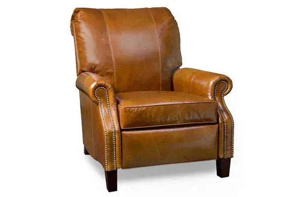 Leather recliner chair, tan/brown color, wooden legs, with nailhead trim.