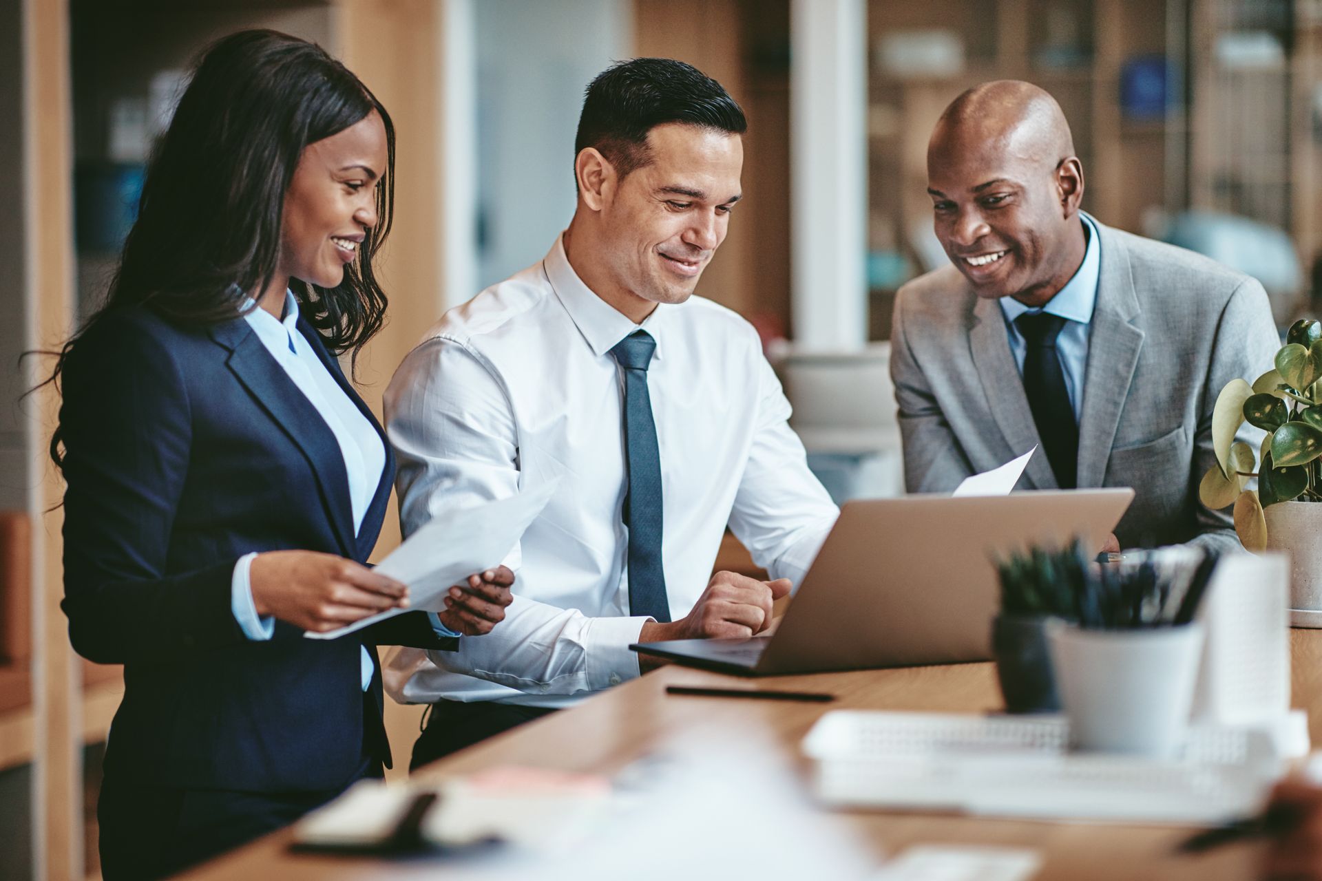 Three diverse business colleagues in a modern office