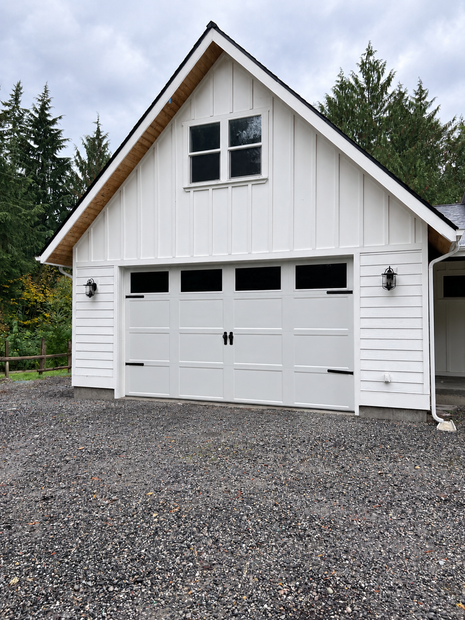 Newly-built timber-frame shop on a cleared rural lot
