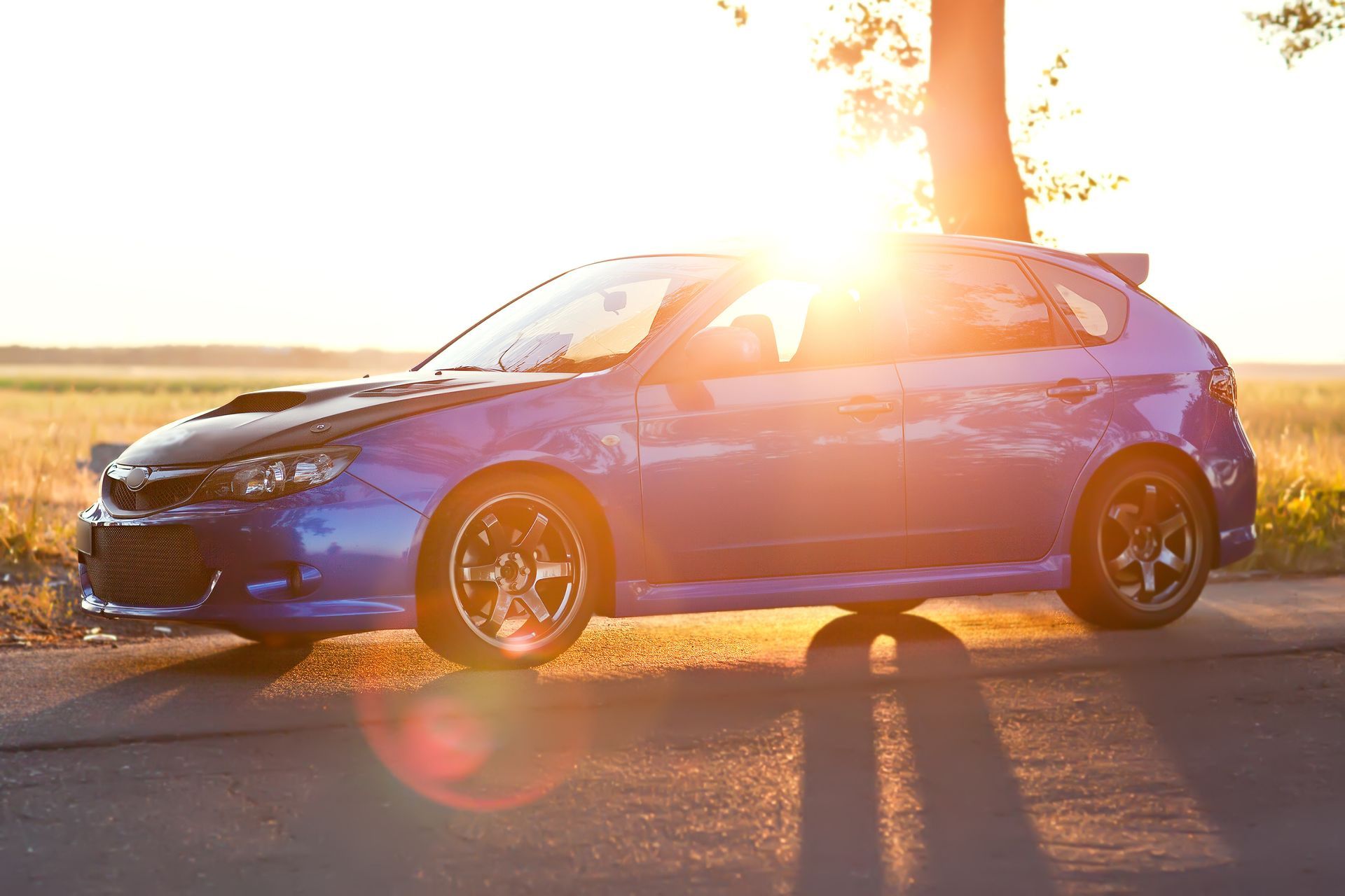 Blue car on the road | Woodie's Auto Service & Repair Centers