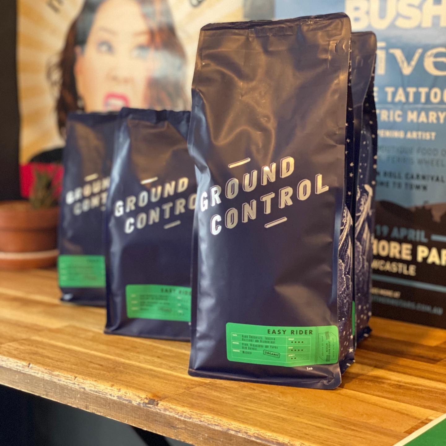Coffee bags on a wooden shelf, labelled 