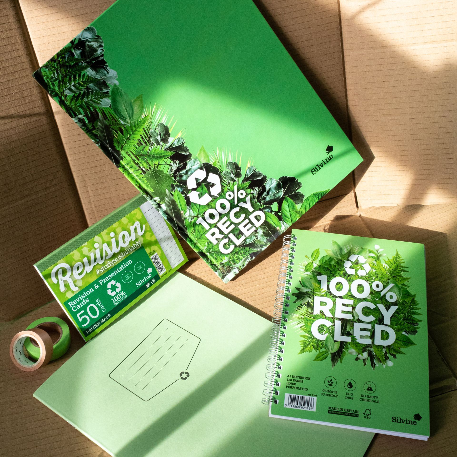 A notebook, refill pad and revision cards from the sustainable range by Silvine on brown paper background