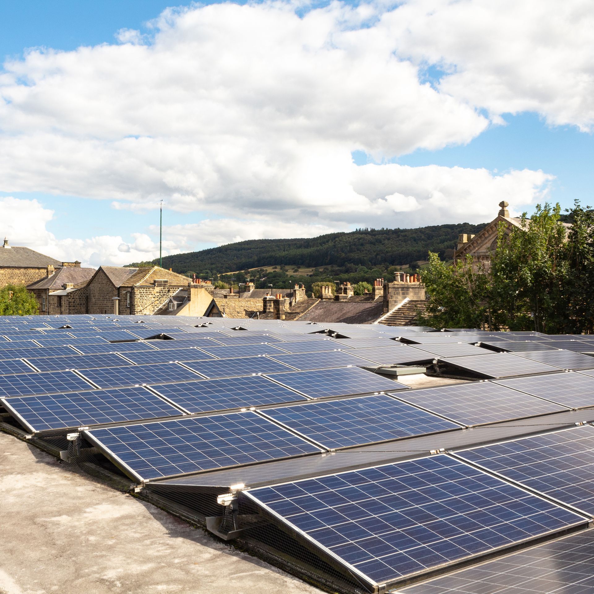 Solar panels that appear on the roof of the factory.
