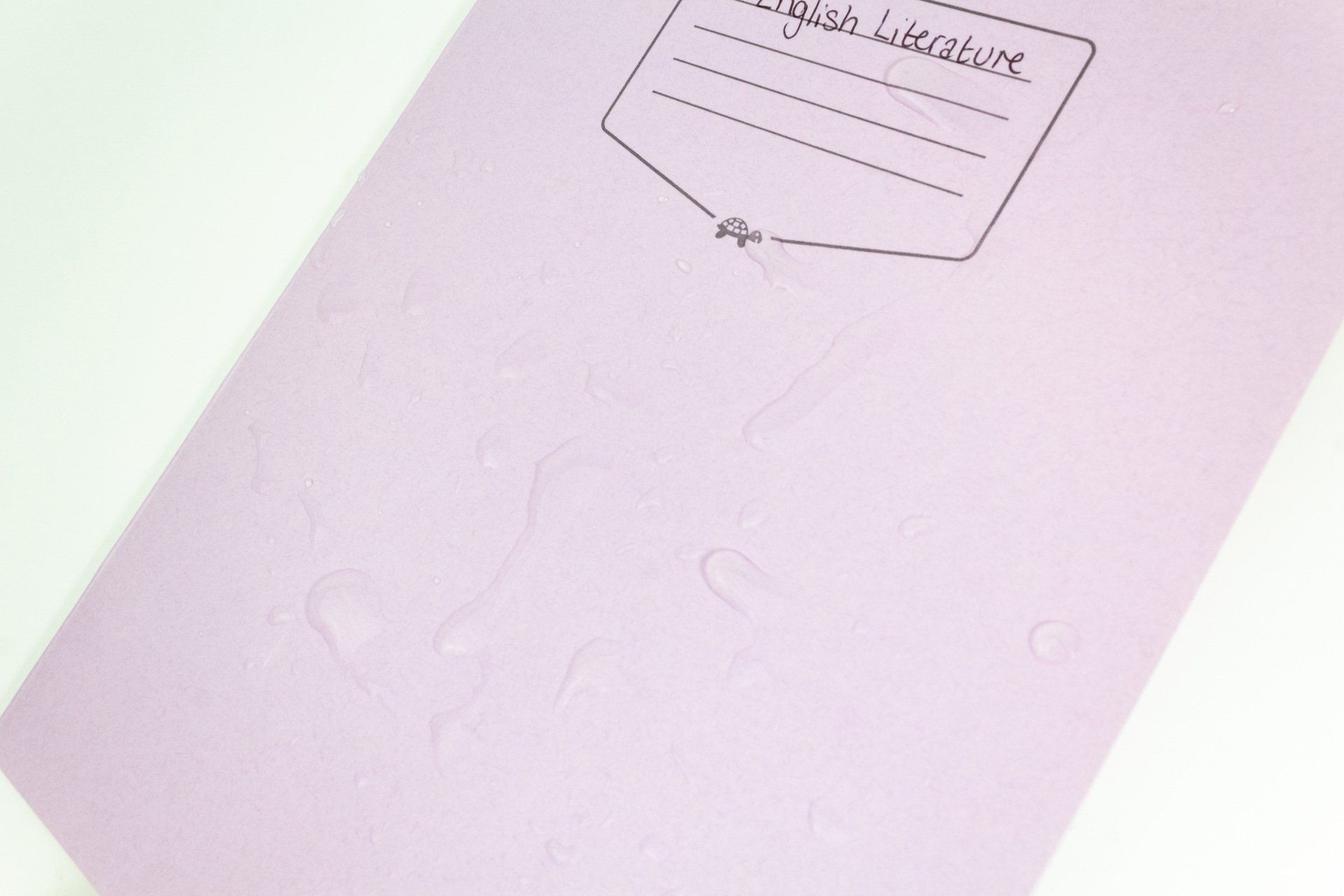 Image of Tough Shell Exercise Book having water spillage cleaned up and still intact.