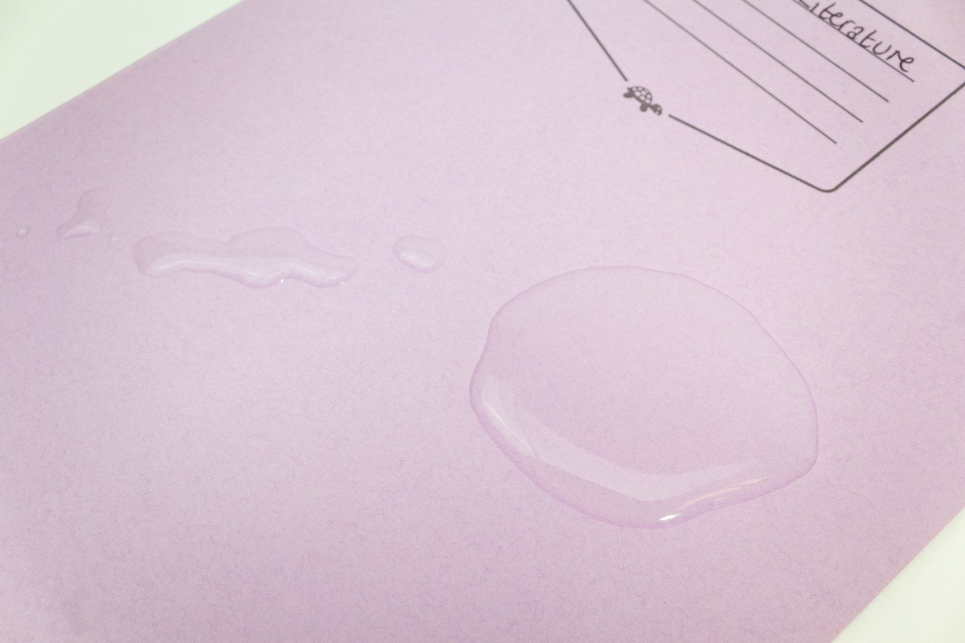 Image of Tough Shell Exercise Book having water spillage cleaned up and still intact.