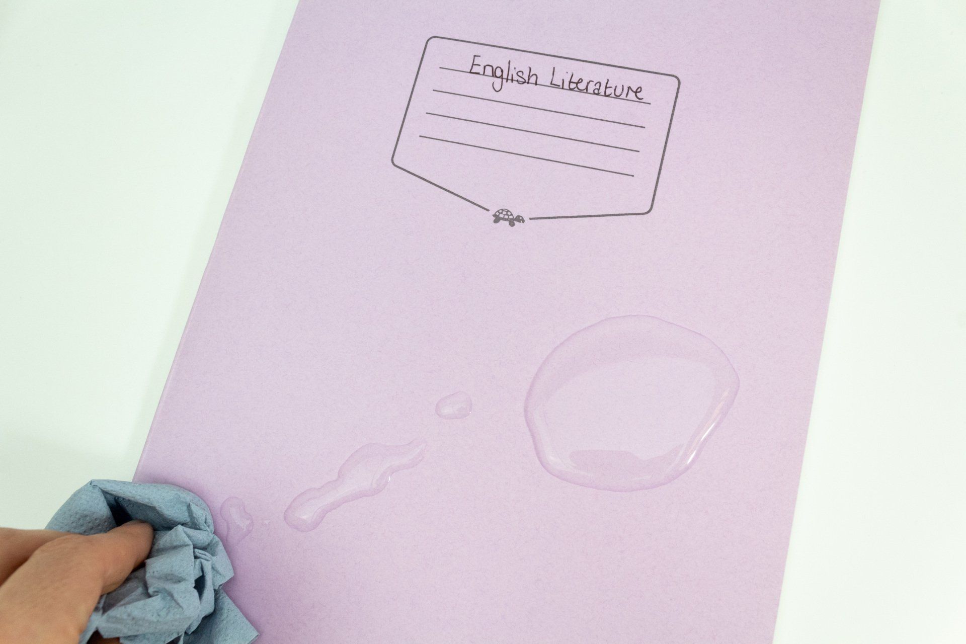Image of Tough Shell Exercise Book having water spillage cleaned up and still intact.