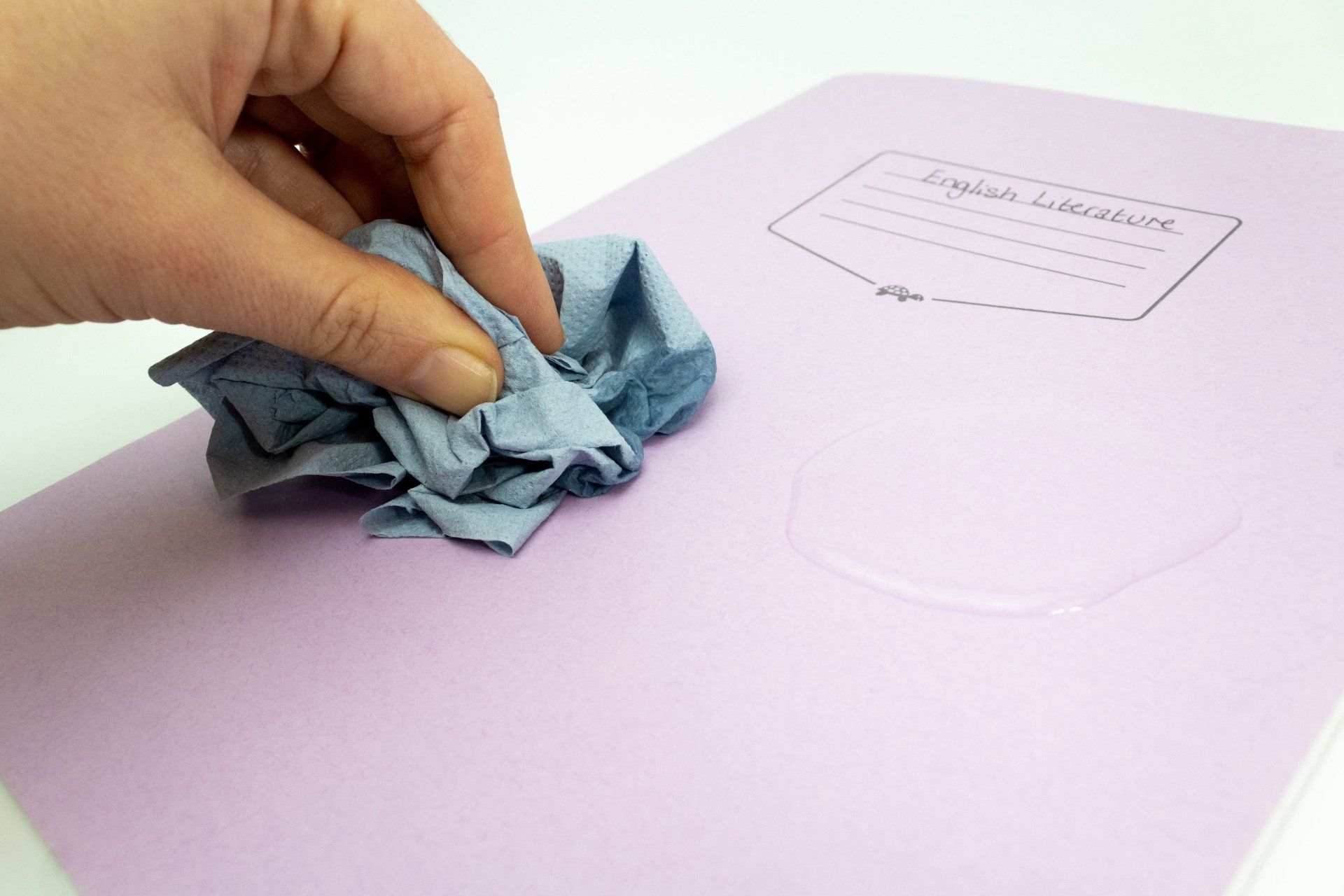 Image of Tough Shell Exercise Book having water spillage cleaned up and still intact.