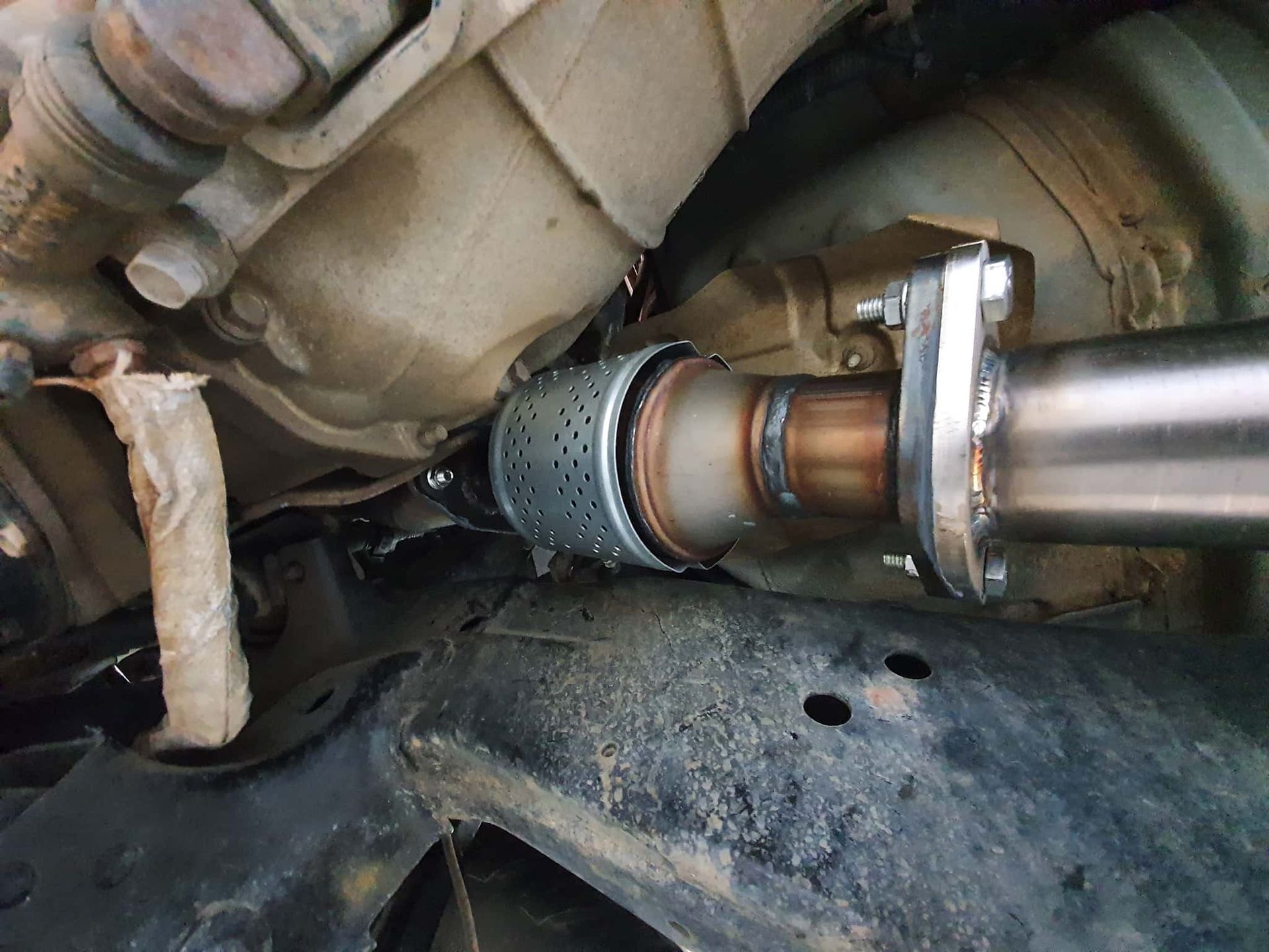 A Close Up of a Exhaust Pipe on the Underside of a Car — OSP Automotive & Marine In Grafton, NSW