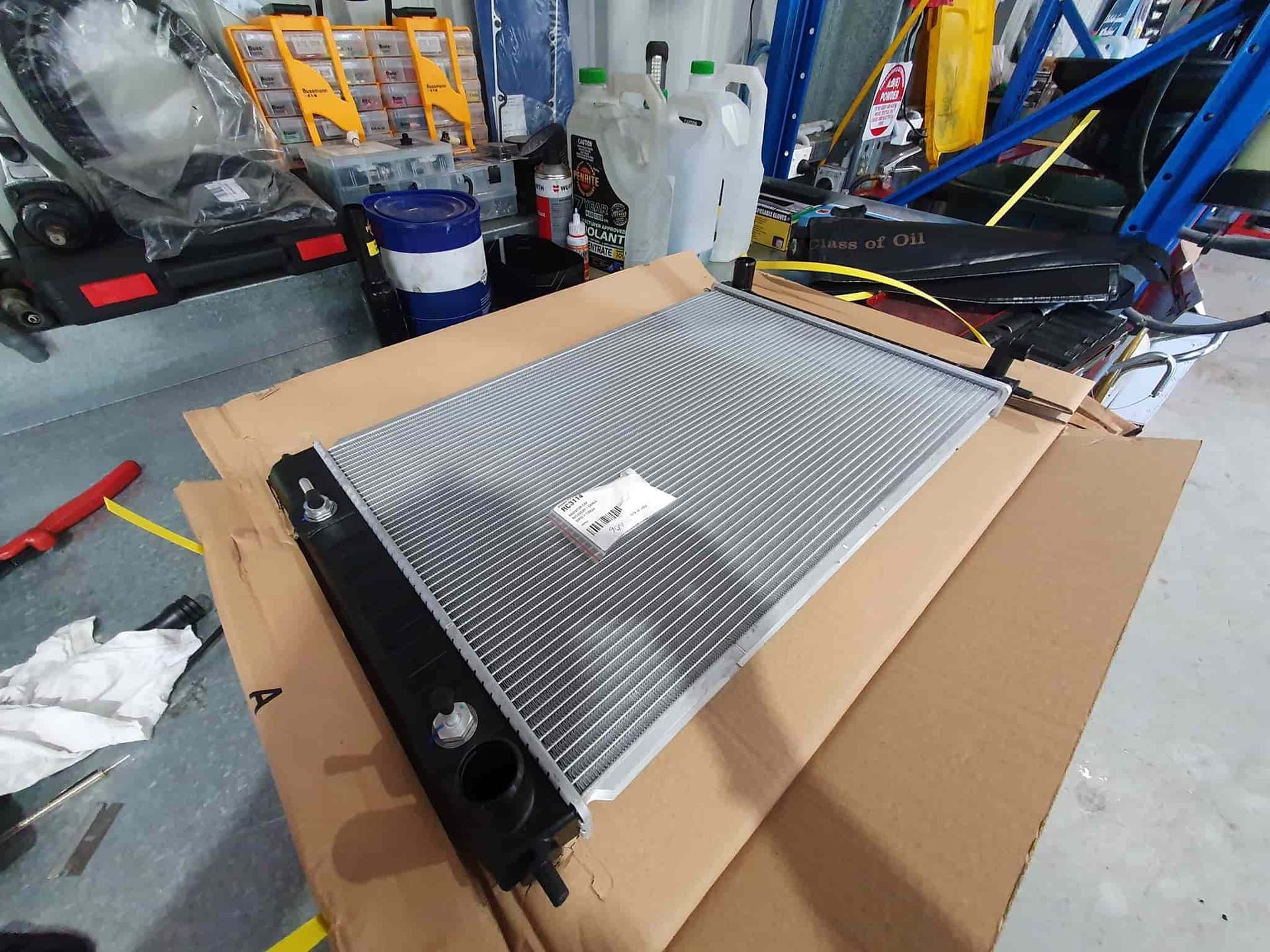 A Radiator is Sitting on Top of a Cardboard Box — OSP Automotive & Marine In Grafton, NSW