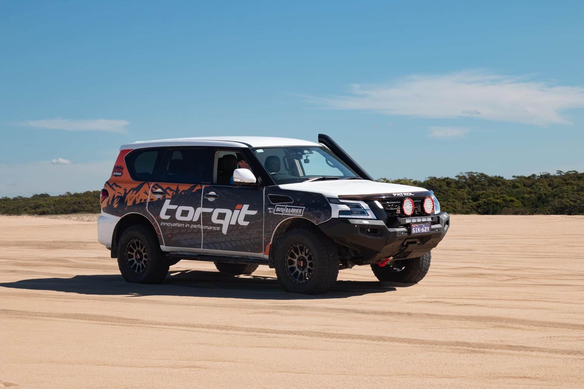 A Black and White Suv is Parked in the Middle of a Dirt Field — OSP Automotive & Marine In Grafton, NSW