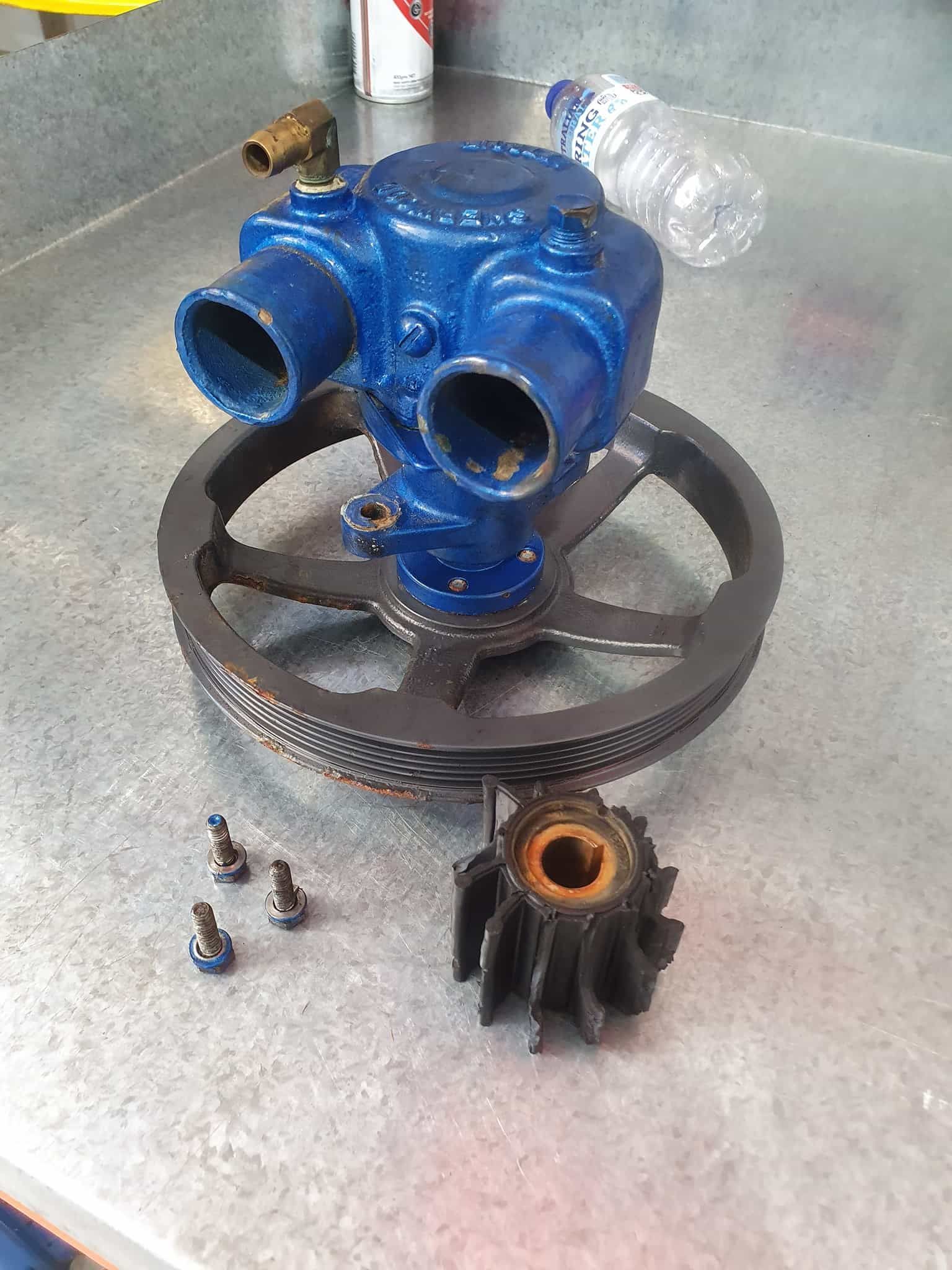 A Blue Machine is Sitting on Top of a Metal Table Next to a Bottle of Water — OSP Automotive & Marine in Iluka, NSW