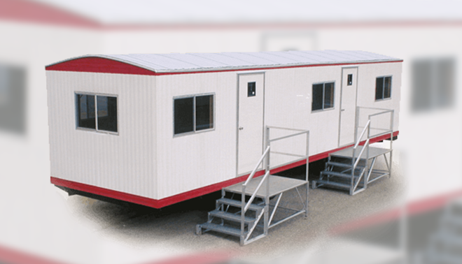 Exterior view of large washroom trailers with multiple entry doors and access stairs.