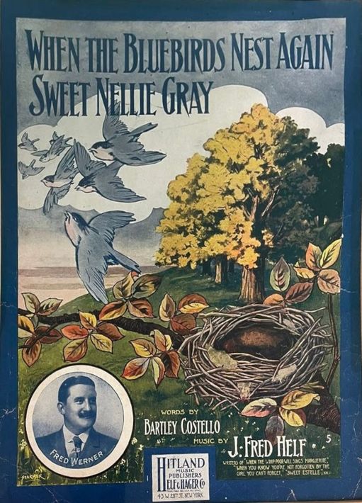 Vintage bladmuziekomslag met blauwe vogels, een nest en een bloeiende boom onder de titel 
