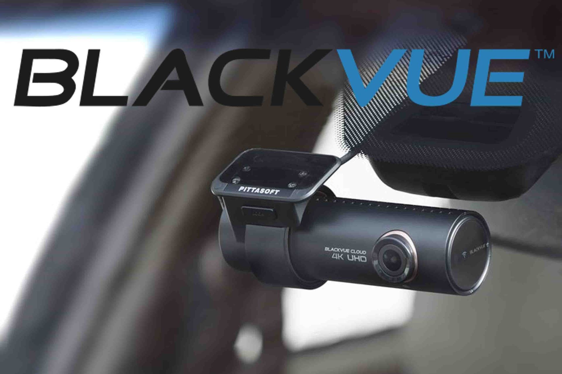 BlackVue dash camera mounted on a car windshield with the BlackVue logo.