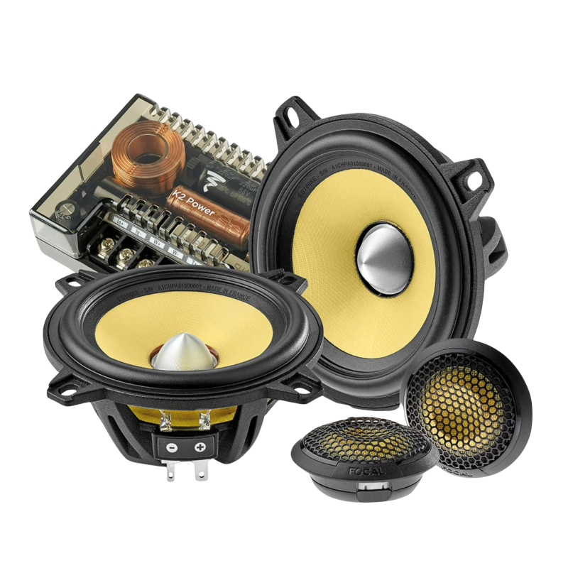 Assorted audio speakers and crossover components, including yellow cone drivers on a white background