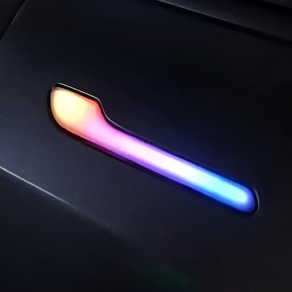 Glowing multicolor curved light bar on a dark surface