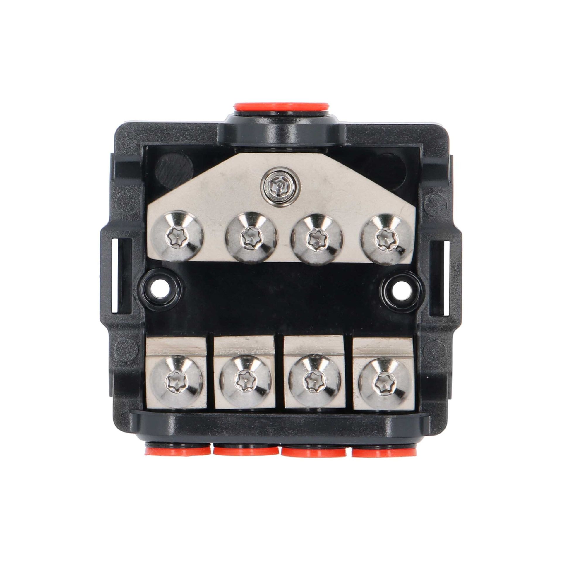 Close-up of a black and silver electrical terminal block with orange tabs