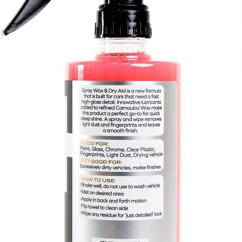 Black spray bottle with red accents and trigger nozzle, labeled “spray wax” on a white background