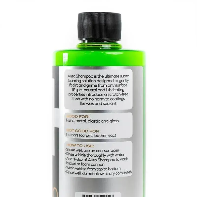 Black and neon green auto shampoo bottle with a silver plus sign on a white background