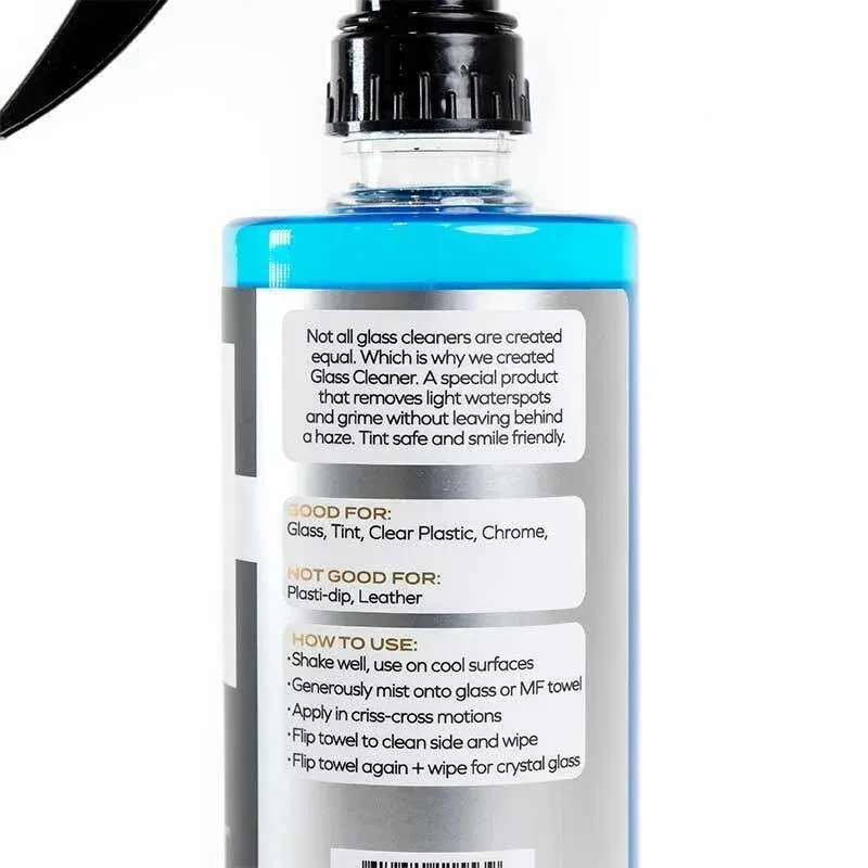 Black glass cleaner spray bottle with blue accents on a white background