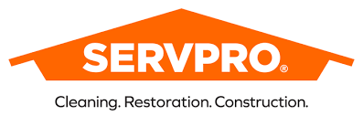 SERVPRO logo with orange roof-shaped graphic and text: Cleaning. Restoration. Construction.