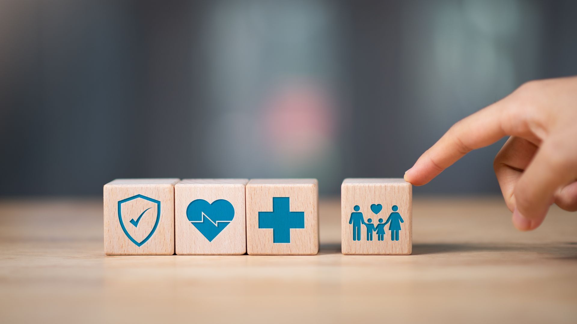 Small business employees in a Sarasota, Florida office reviewing group health plan options