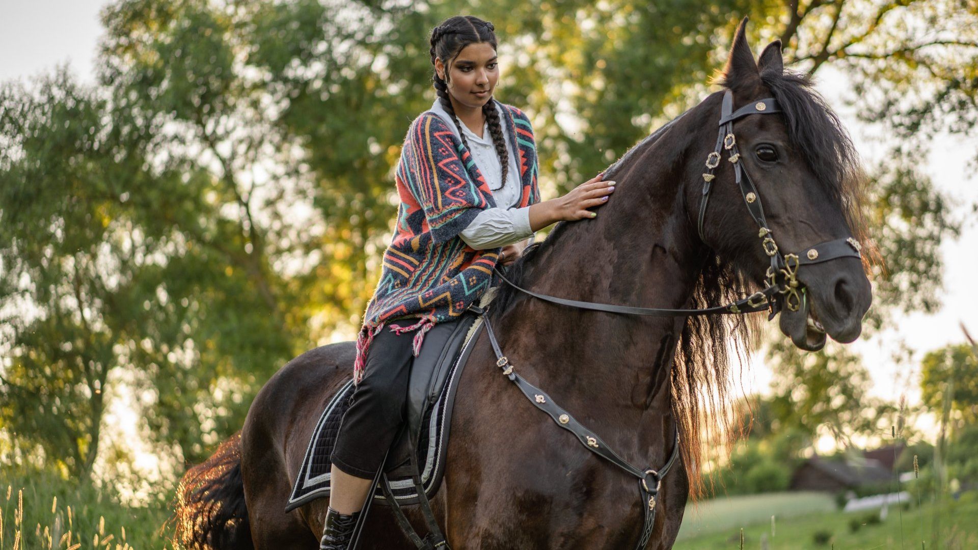 Horseback riding by a woman
