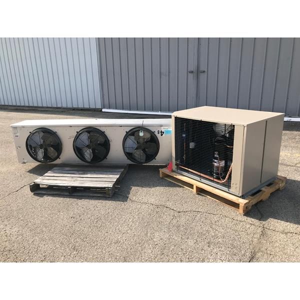 Two industrial refrigeration units on pallets, outdoors.