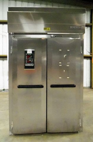Stainless steel commercial refrigerator with two doors.