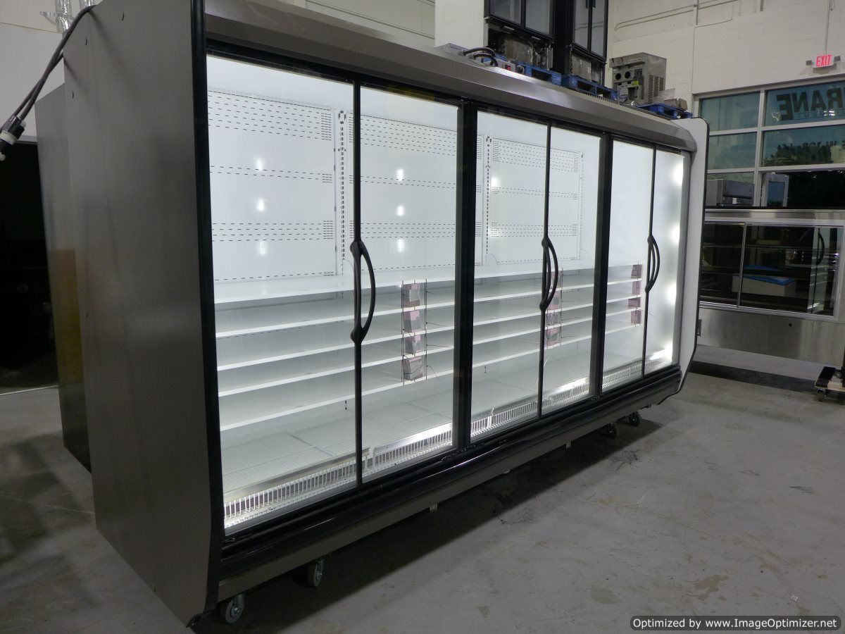Large commercial refrigerator with glass doors and interior lighting.
