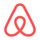 Airbnb logo: red stylized heart-like loop on white background