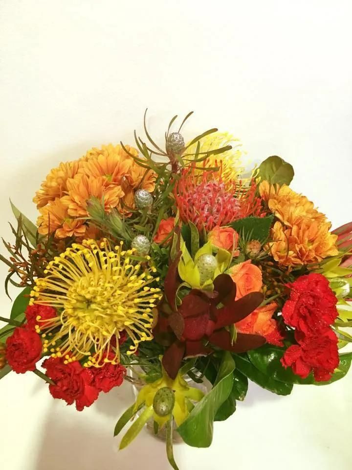 A Bunch of Flowers Are Sitting on a Table — Flower Hunt in Robina, QLD