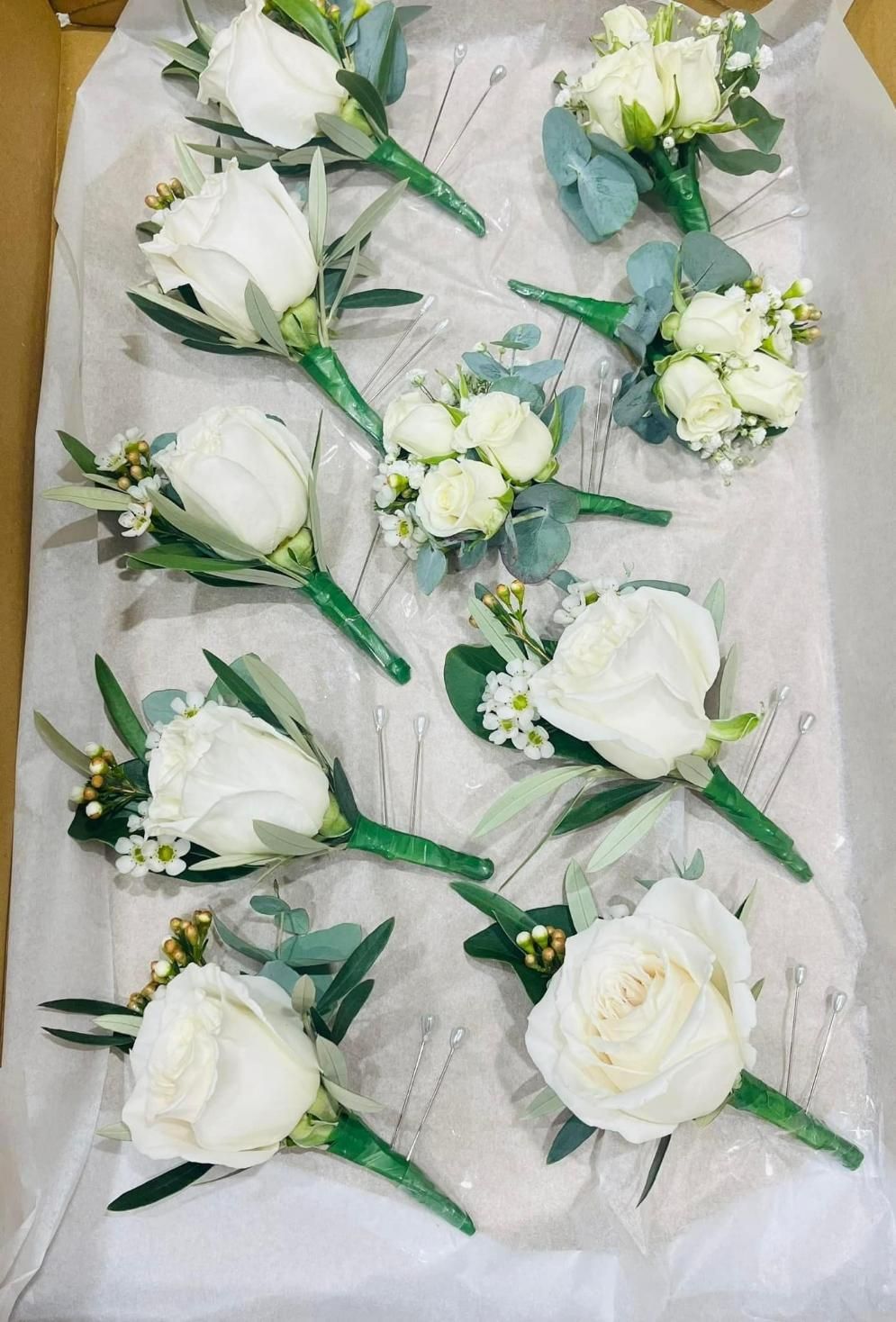 A Box Filled With White Roses and Green Leaves — Flower Hunt in Robina, QLD