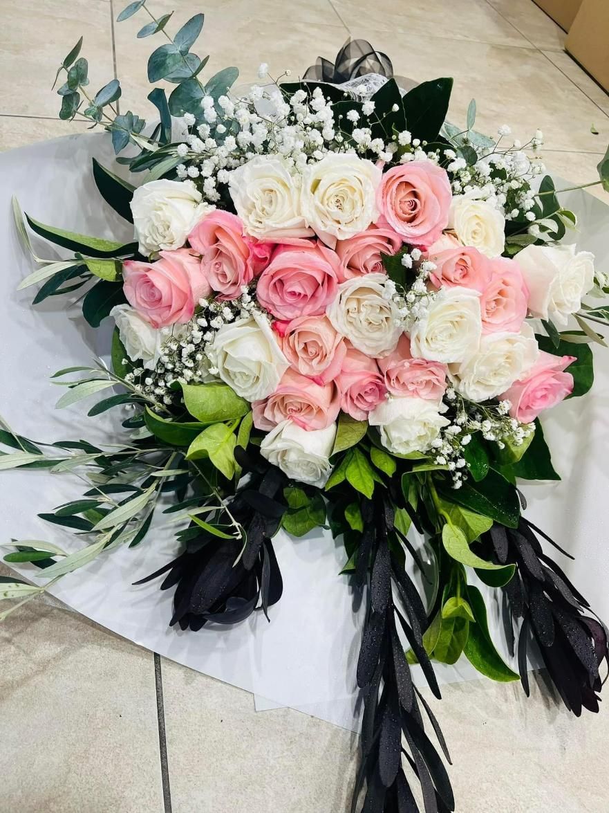 A Bouquet of Pink and White Roses With Baby's Breath and Black Feathers — Flower Hunt in Robina, QLD