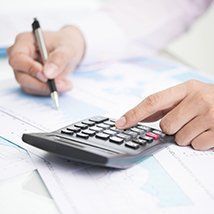 Income Tax Preparation- forms, pen, calculator