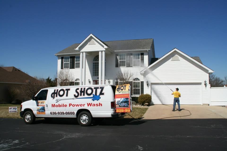 Power washing a two story home in O'Fallon MO. 