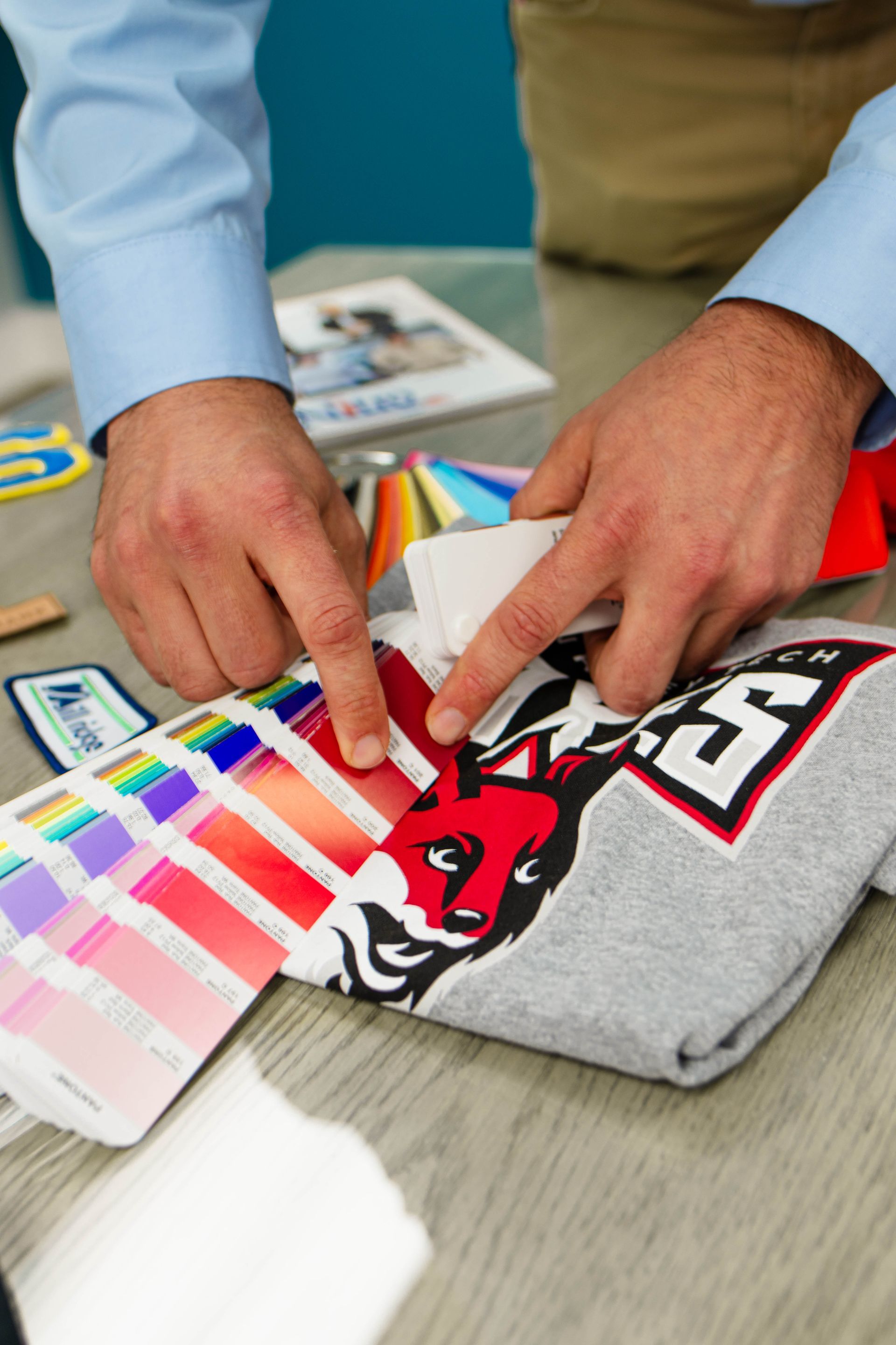 A man is looking at a t-shirt with a fox on it