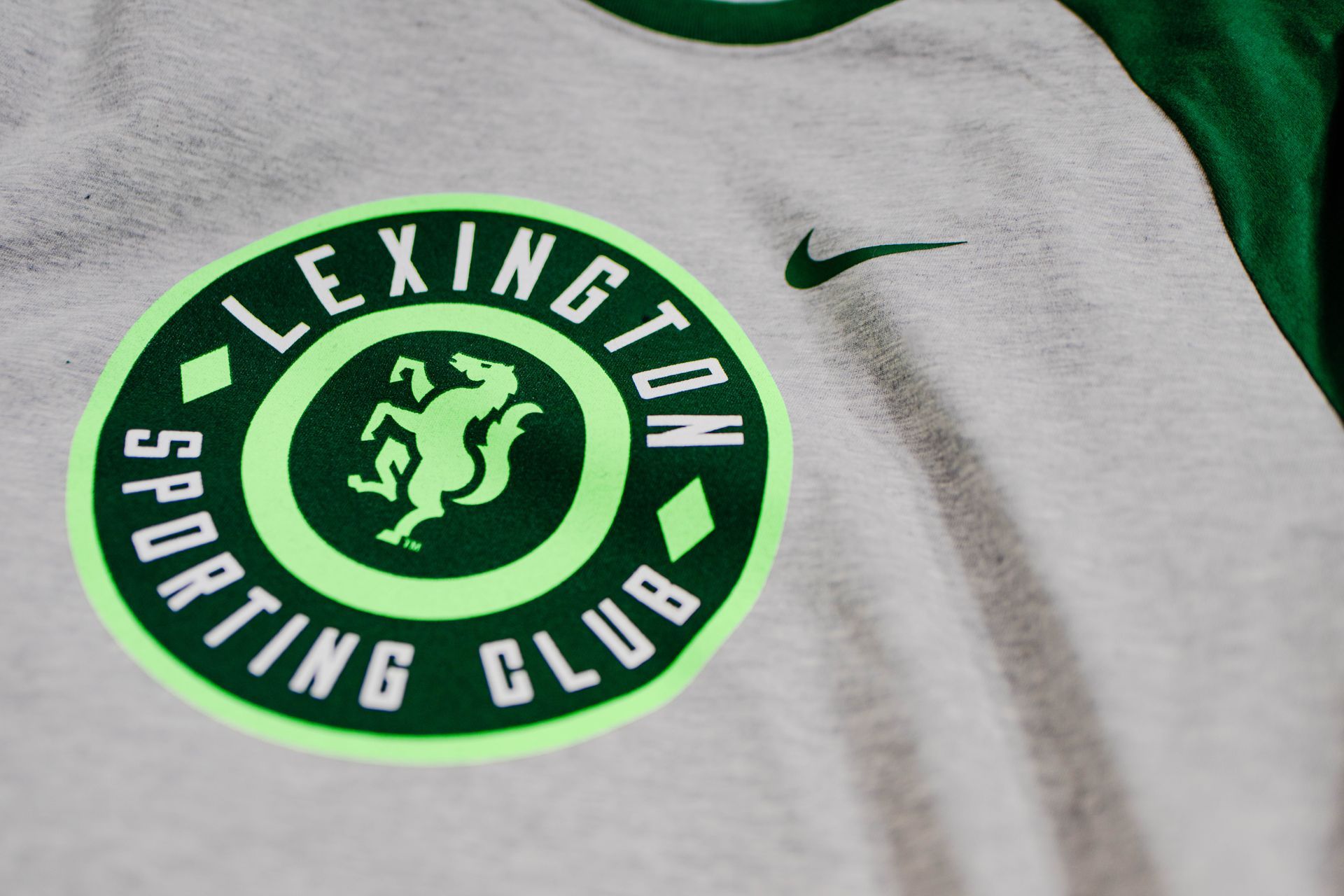Lexington sporting club logo on a white shirt
