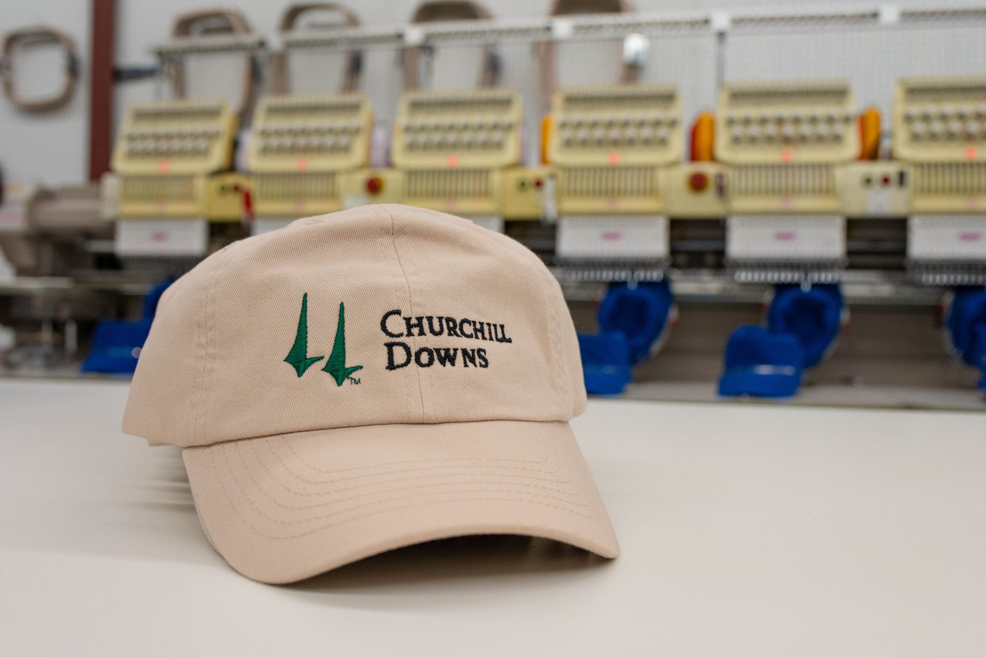 A baseball cap that says churchill downs on it