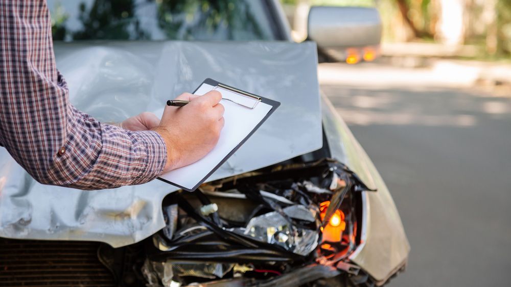 Insurance Agent Checking Car — Panel Beater in Griffith, NSW