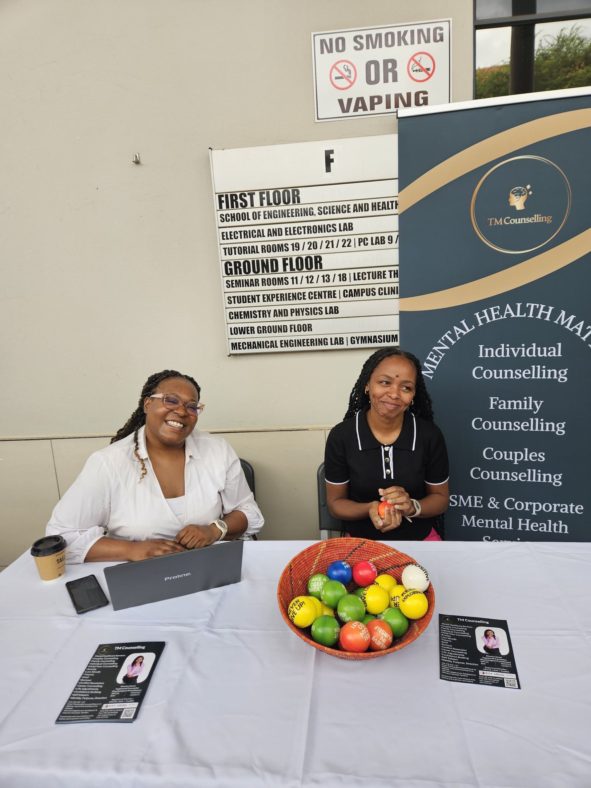 Sandy Kass and Phozisa Xwazi smile at Emmeris Wellness day.