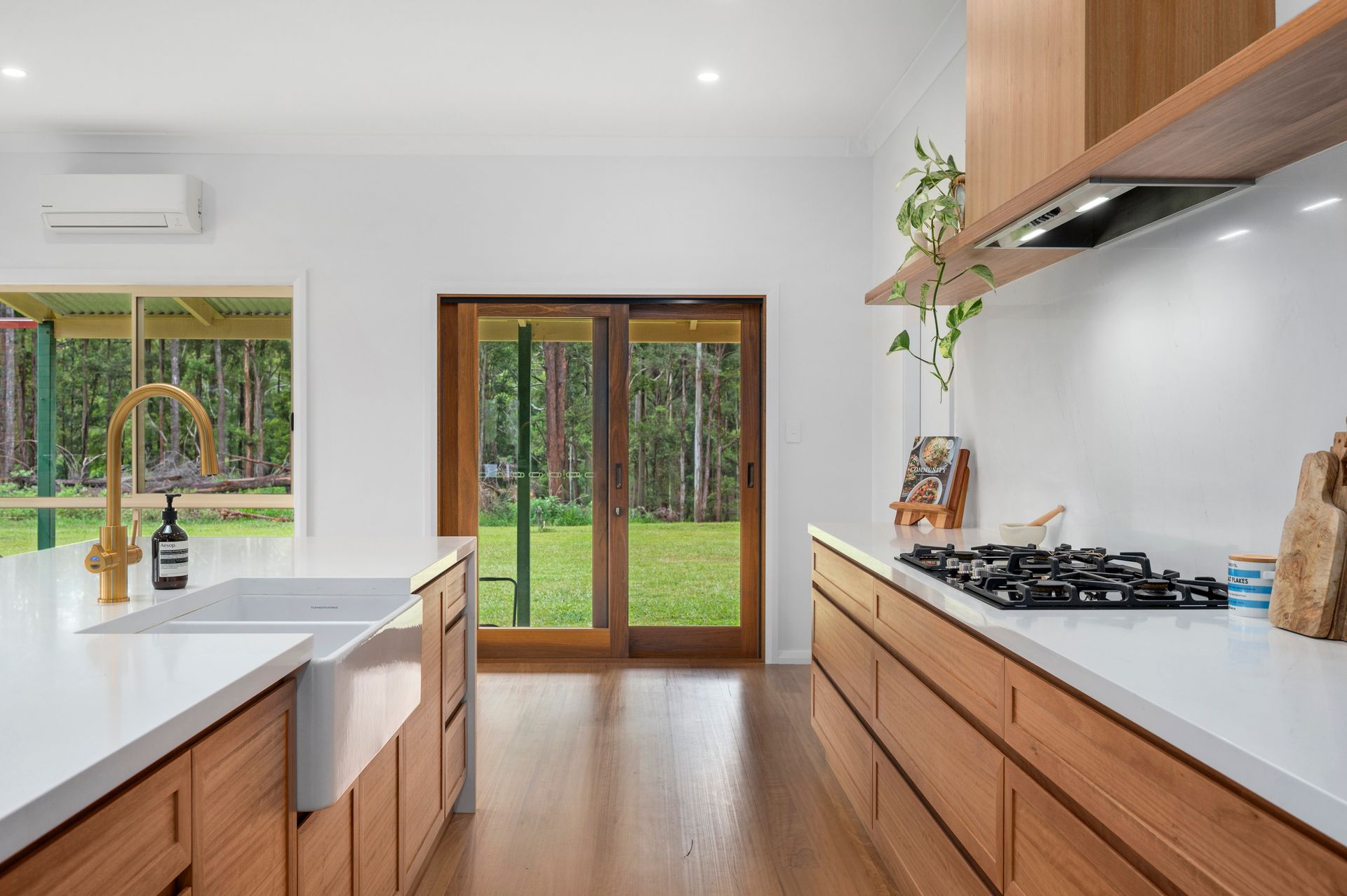 A Large Kitchen Area Looking Out to Back Lawn— Plumbe Joinery in Coffs Harbour, NSW