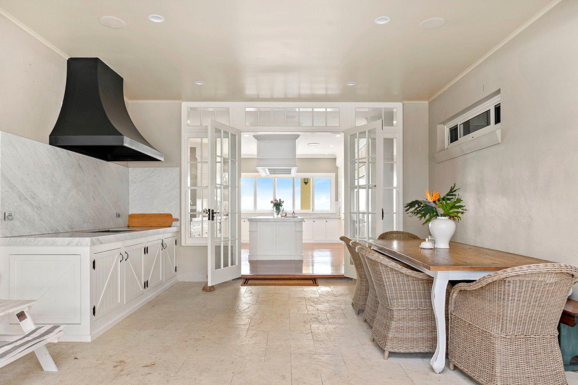 A Kitchen With White Cabinets And A Stainless Steel Grill — Plumbe Joinery in Woolgoolga, NSW