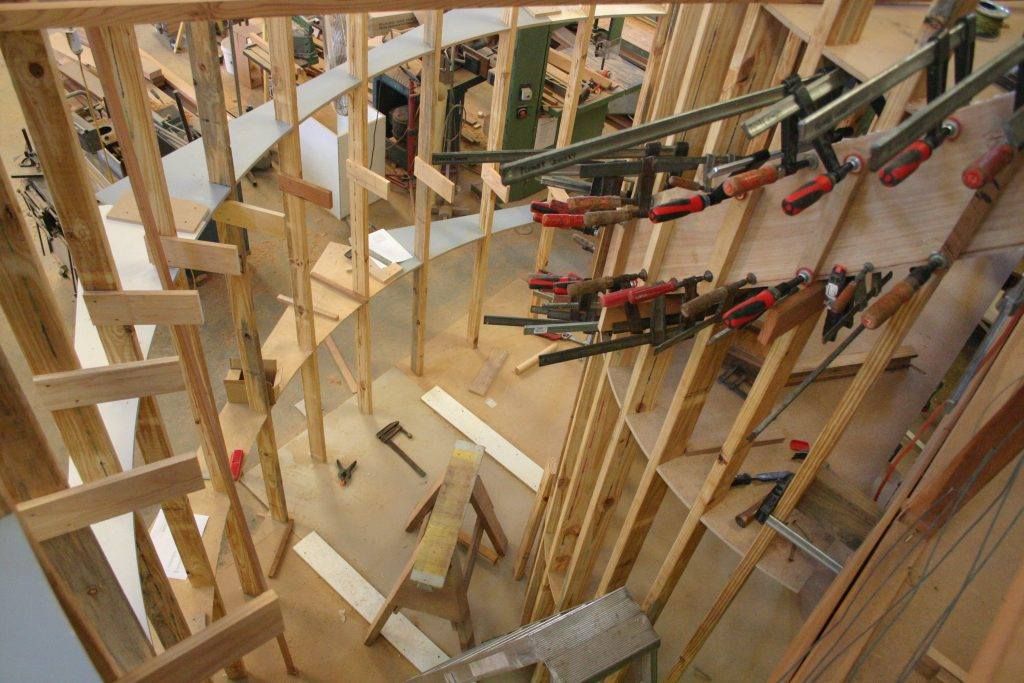 A Wooden Structure With A Lot Of Clamps On It — Plumbe Joinery in Coffs Harbour, NSW