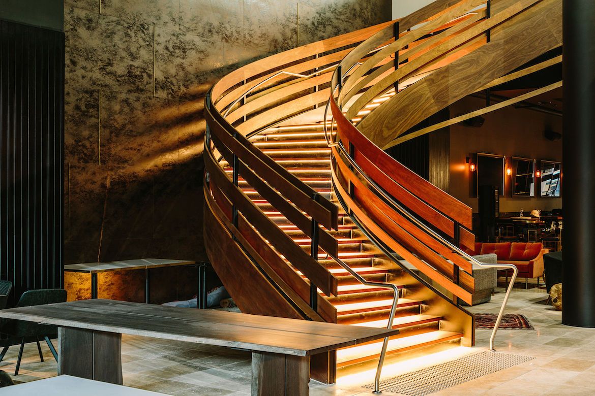 A Beautiful Spiral Staircase with Lighting under steps— Plumbe Joinery in Coffs Harbour, NSW